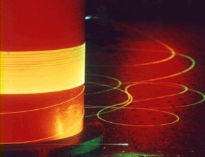 Fibre optic cable lit by laser light.